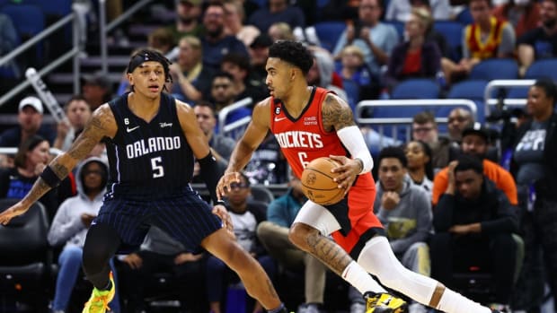 Nov 7, 2022; Orlando, Florida, USA; Houston Rockets forward Kenyon Martin Jr. (6) drives to the basket as Orlando Magic forward Paolo Banchero (5) defends during the second half at Amway Center. Mandatory Credit: Kim Klement-USA TODAY Sports